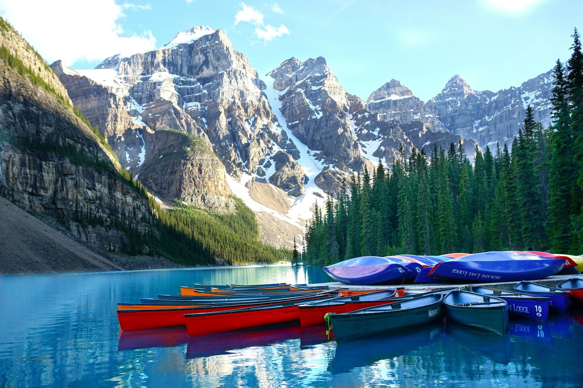 Canoes on turquoise Moraine Lake below the Valley of the Ten Peaks in the Alberta Rockies