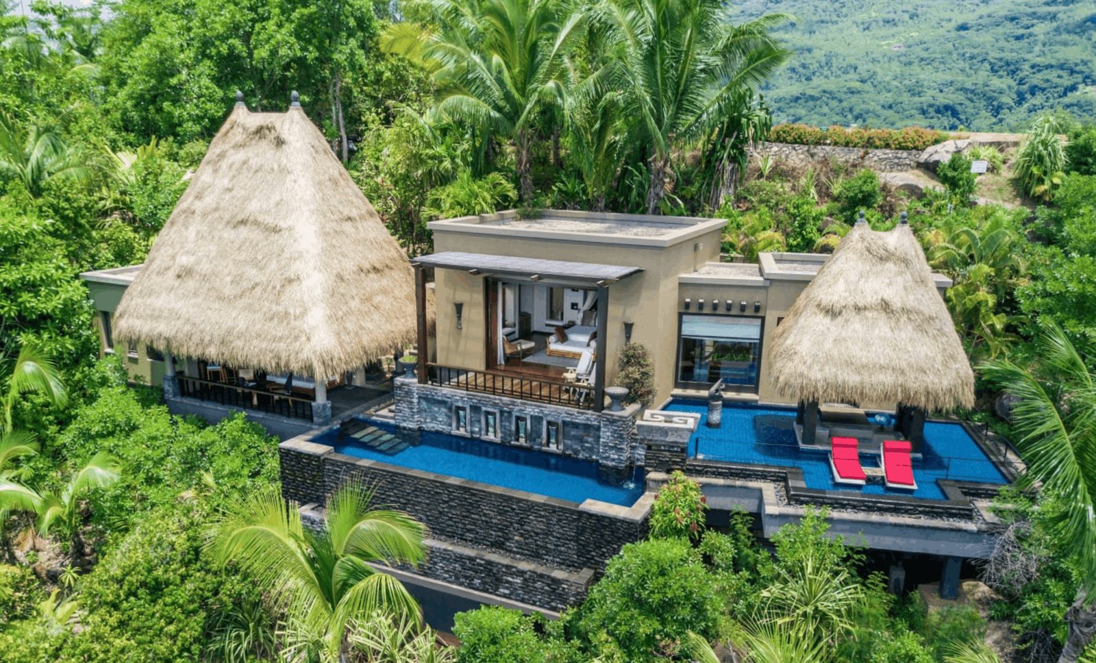 A villa with private infinity pool in tropical gardens at Anantara Maia, Mahé, Seychelles