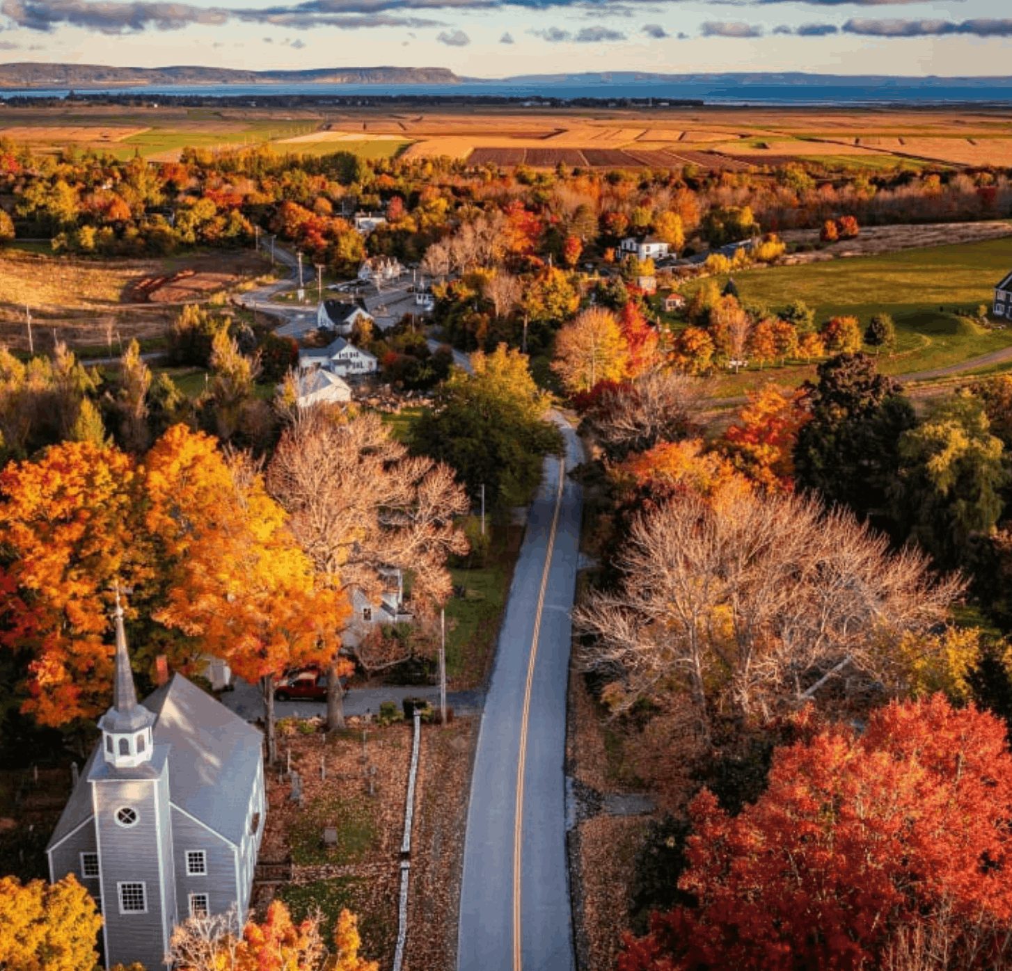A colourful harbour and lighthouse in the Canadian Maritimes