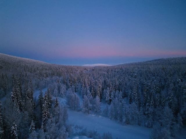 A family husky sledding on a Father Christmas holiday in Lapland