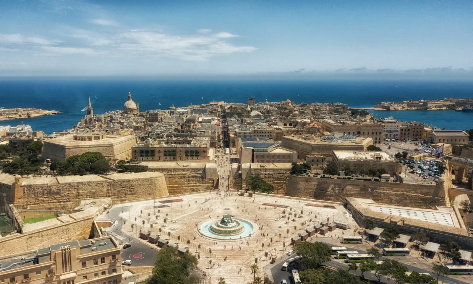 An aerial view of Valletta with the Triton Fountain, fortifications and the sea beyond, Malta