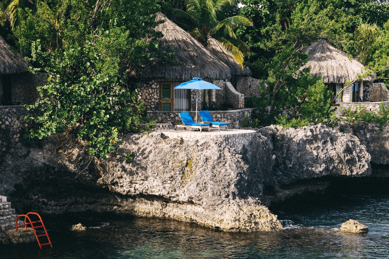 Thatched villas overlooking the Caribbean Sea at Rockhouse Hotel in Negril, Jamaica