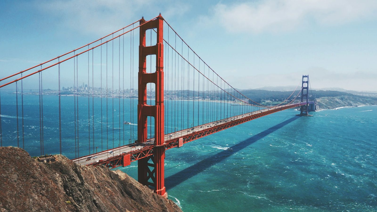 The Golden Gate Bridge over San Francisco Bay with the city skyline beyond