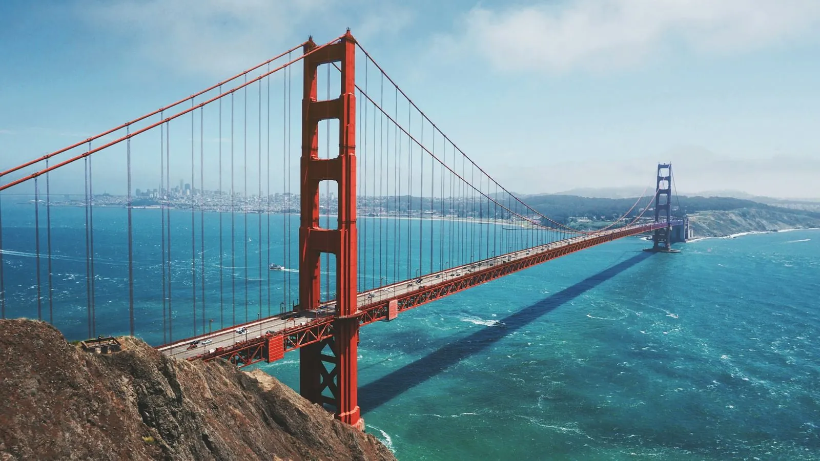 The Golden Gate Bridge over San Francisco Bay with the city skyline beyond