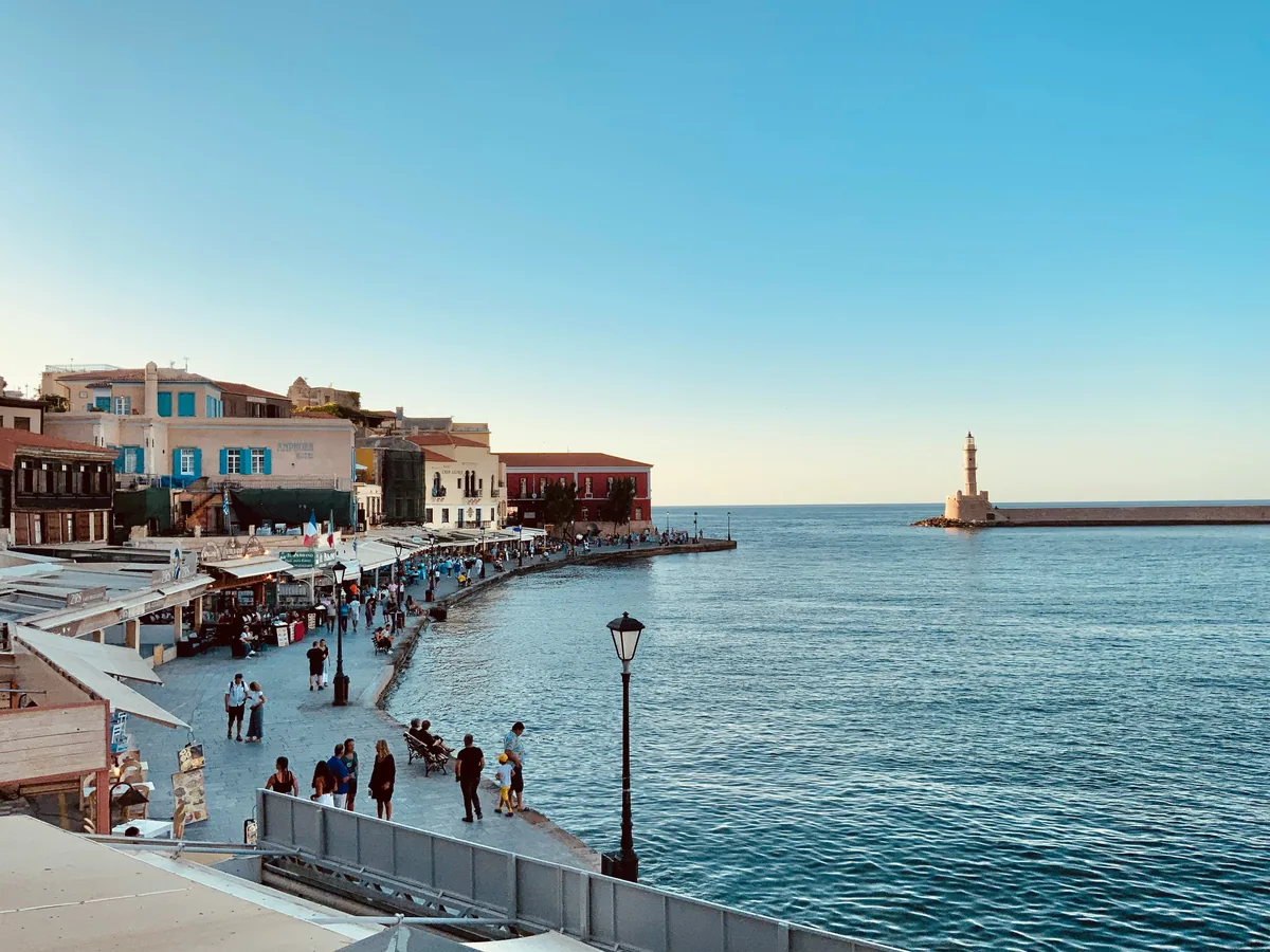 The Venetian harbour at Chania with the White Mountains behind, a popular base for villa holidays Crete.