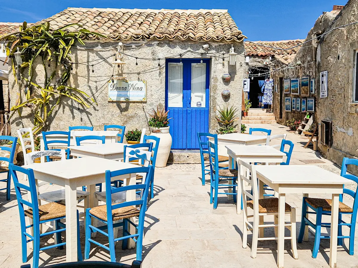 A village taverna table in Crete, the slow rhythm that villa holidays Crete are made for.