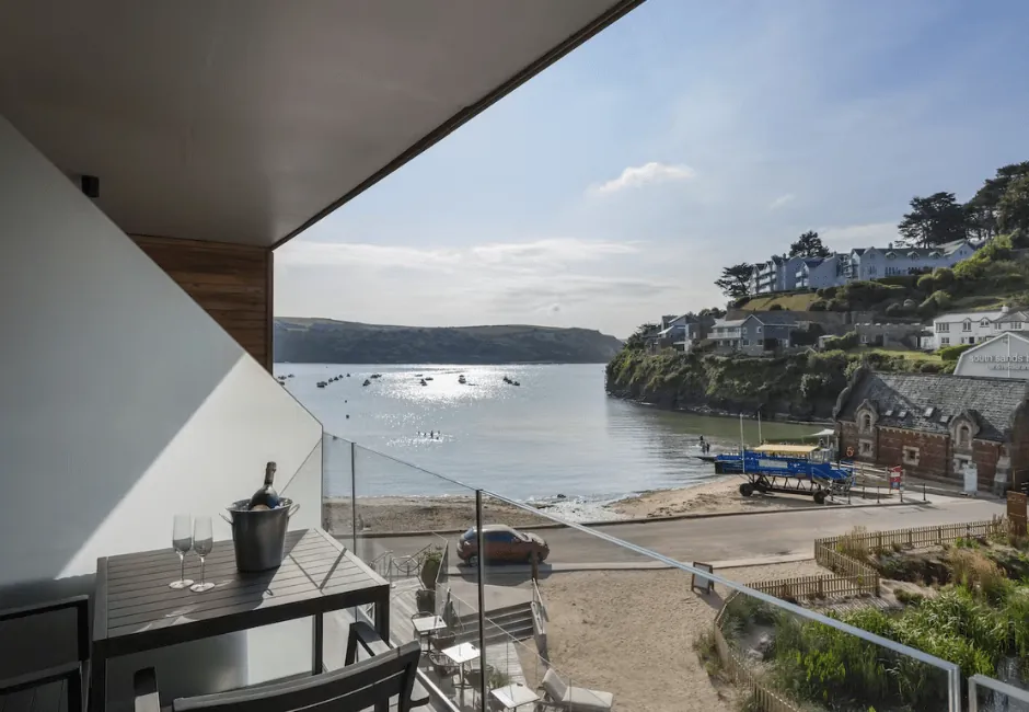 Holiday cottages with direct beach access in South Devon - Sailor’s Cove apartment overlooking Salcombe’s South Sands beach with balcony views.