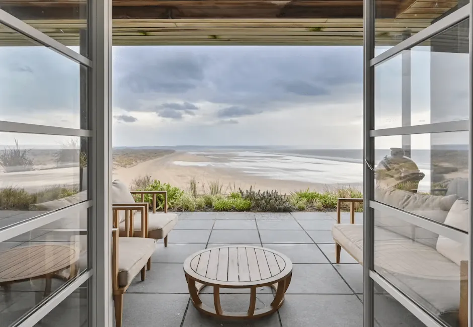 Holiday cottages with direct beach access in North Devon - modern beachfront apartment at Saunton Sands with terrace and sea views.
