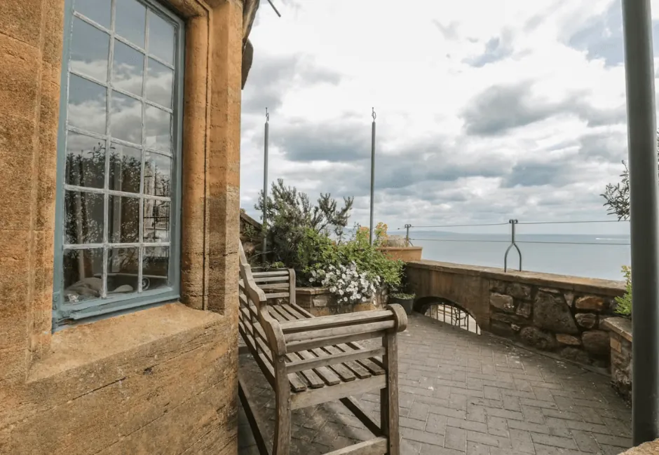Holiday cottages with direct beach access in Lyme Regis - The Golden Stars, a four-storey seafront home with coastal views and easy beach access.